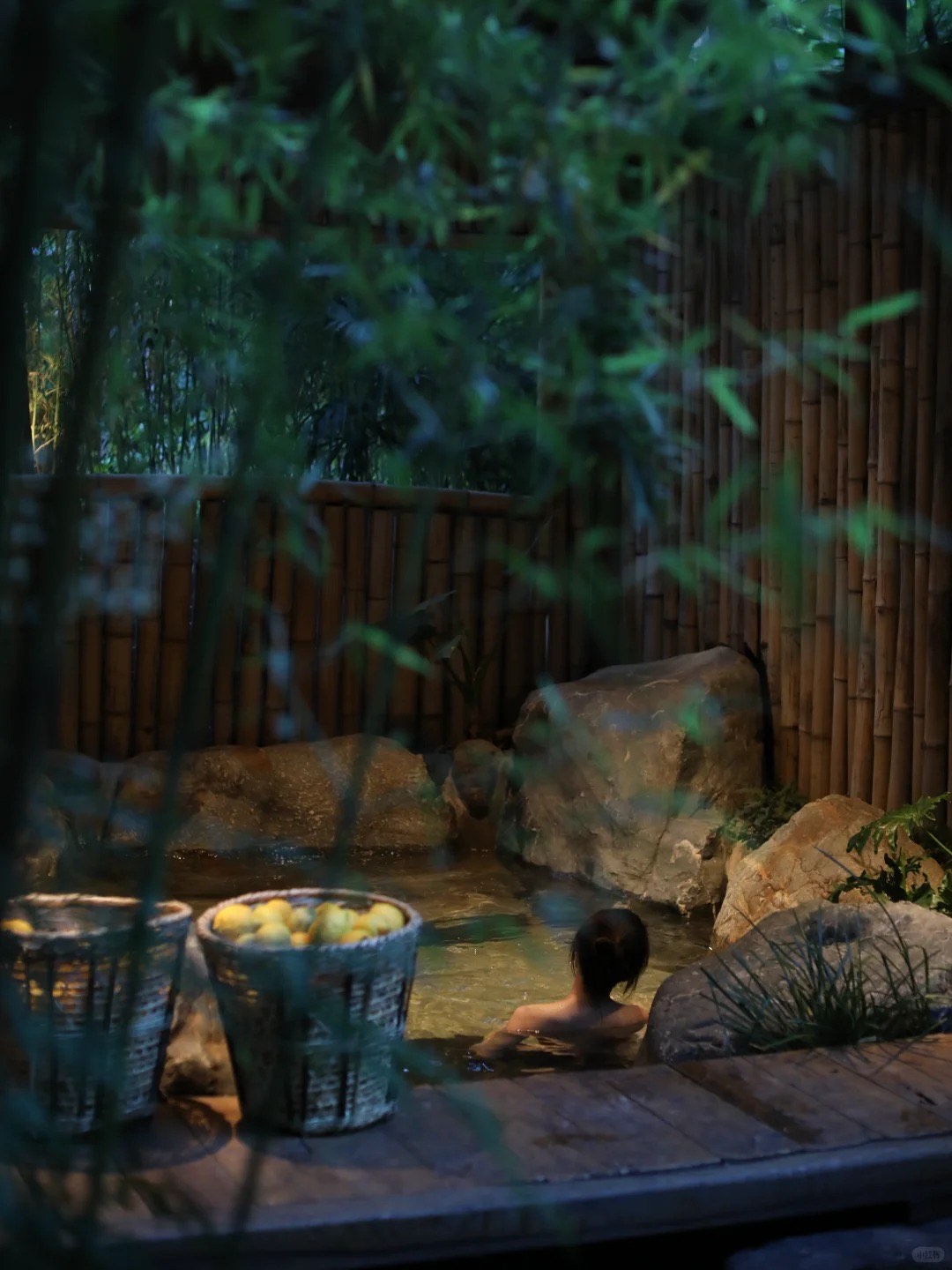 Eryuan Pushan Forest Hot Spring resort in North Erhai county — private mineral pools under open sky after dark, Yunnan