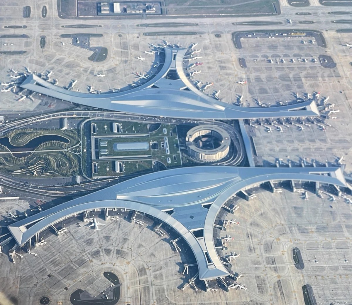 Chengdu Tianfu International Airport (TFU) from the air — the twin butterfly-shaped terminals set the tone before you've even landed