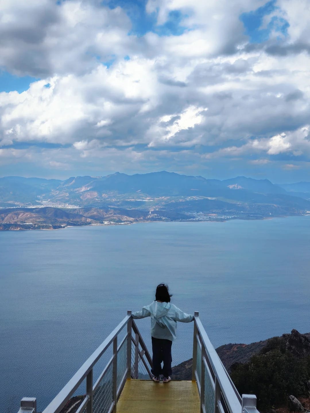 A viewing platform on the cliff boardwalk at Leidashi, Fuxian Lake spread out below