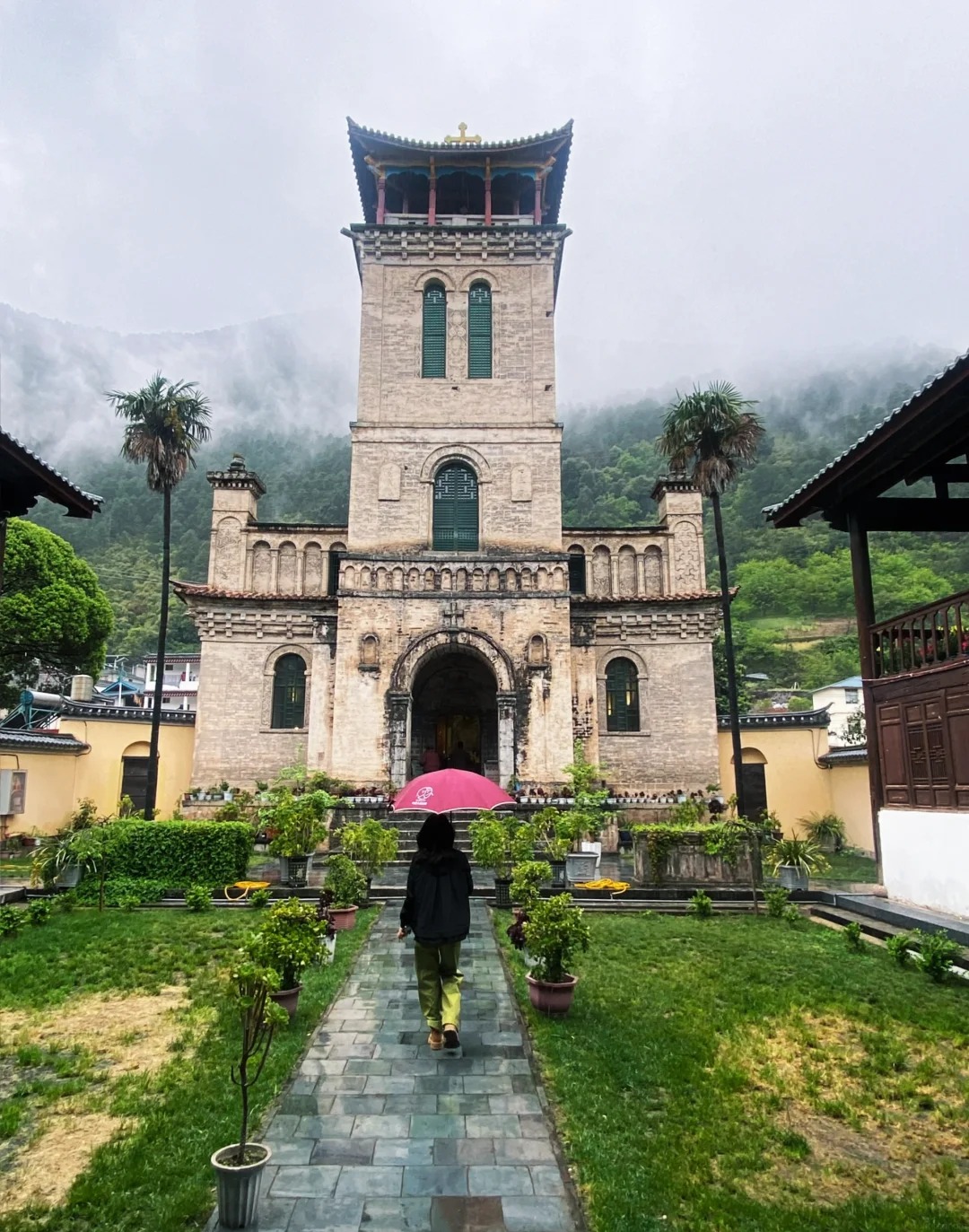 Cizhong's 19th-century French missionary church, painted Chinese-Tibetan arches inside