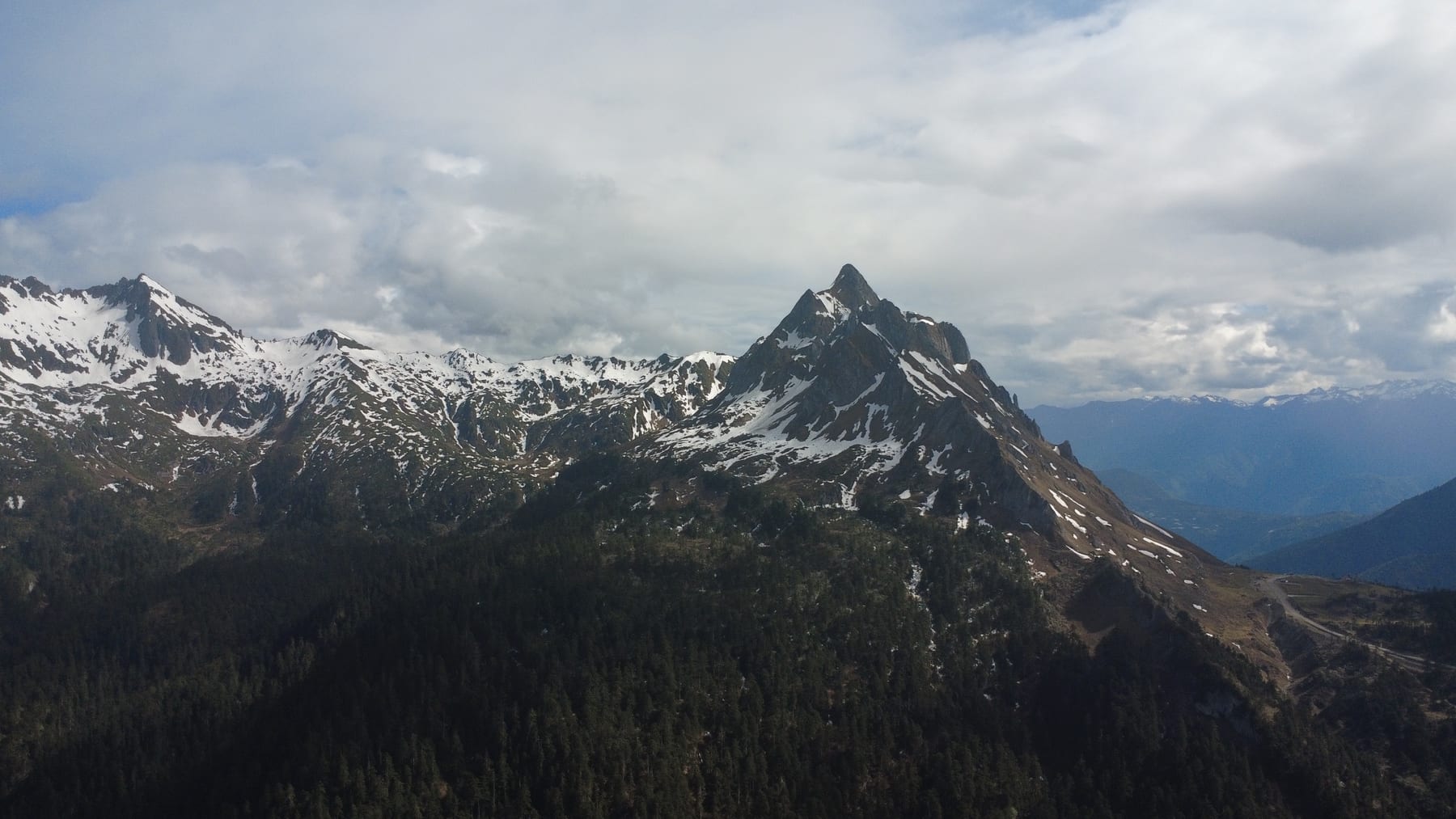 A snow peak on the Biluo range above the road between Bingzhongluo and Cizhong