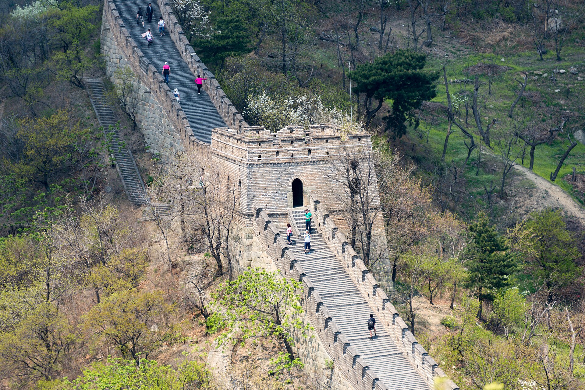A watchtower on the Mutianyu Great Wall (慕田峪长城) with the restored ramparts climbing the ridge behind it, Beijing