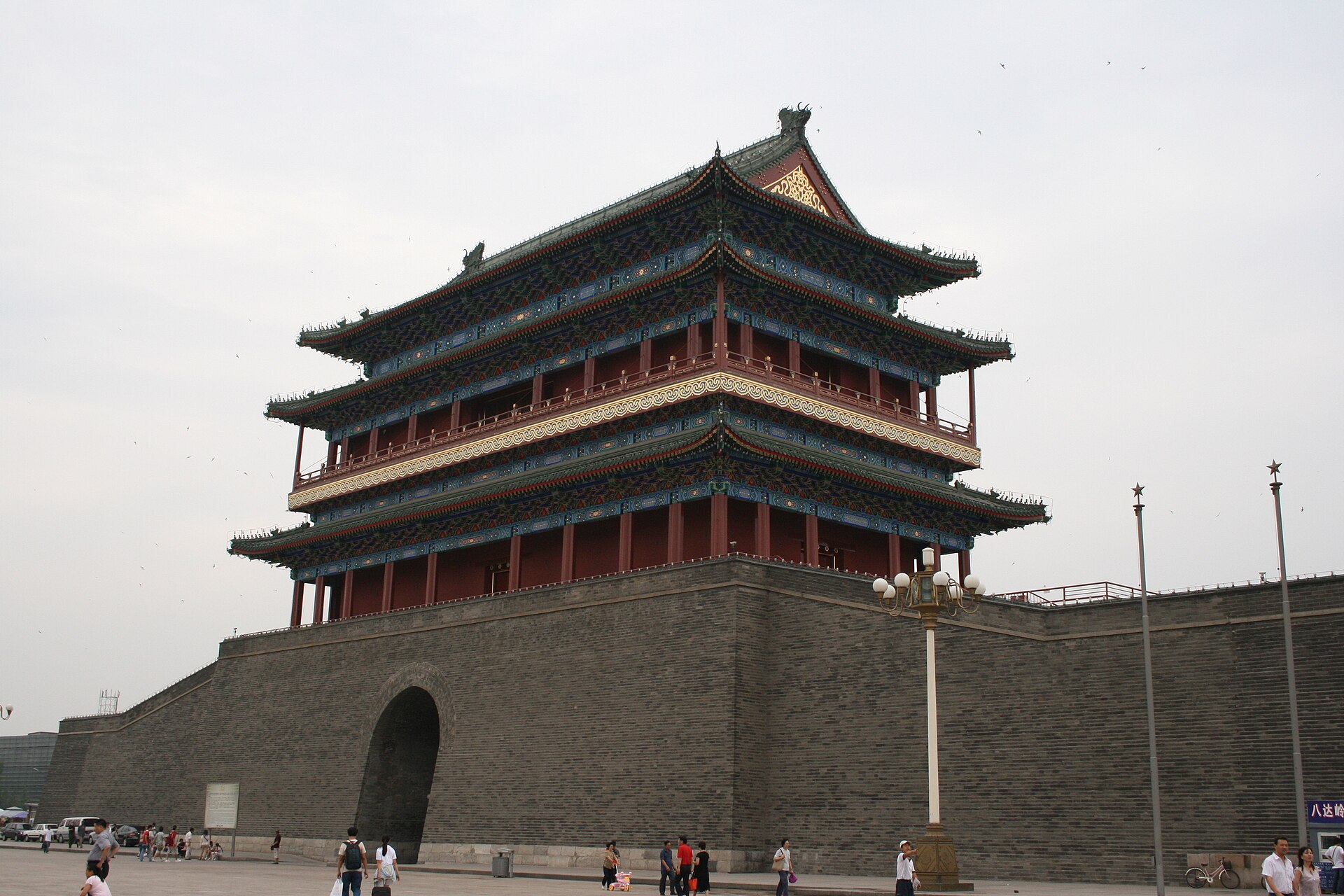 Zhengyangmen (正阳门), the front gate at the head of Qianmen Street, rising over the plaza on its grey brick rampart, Beijing