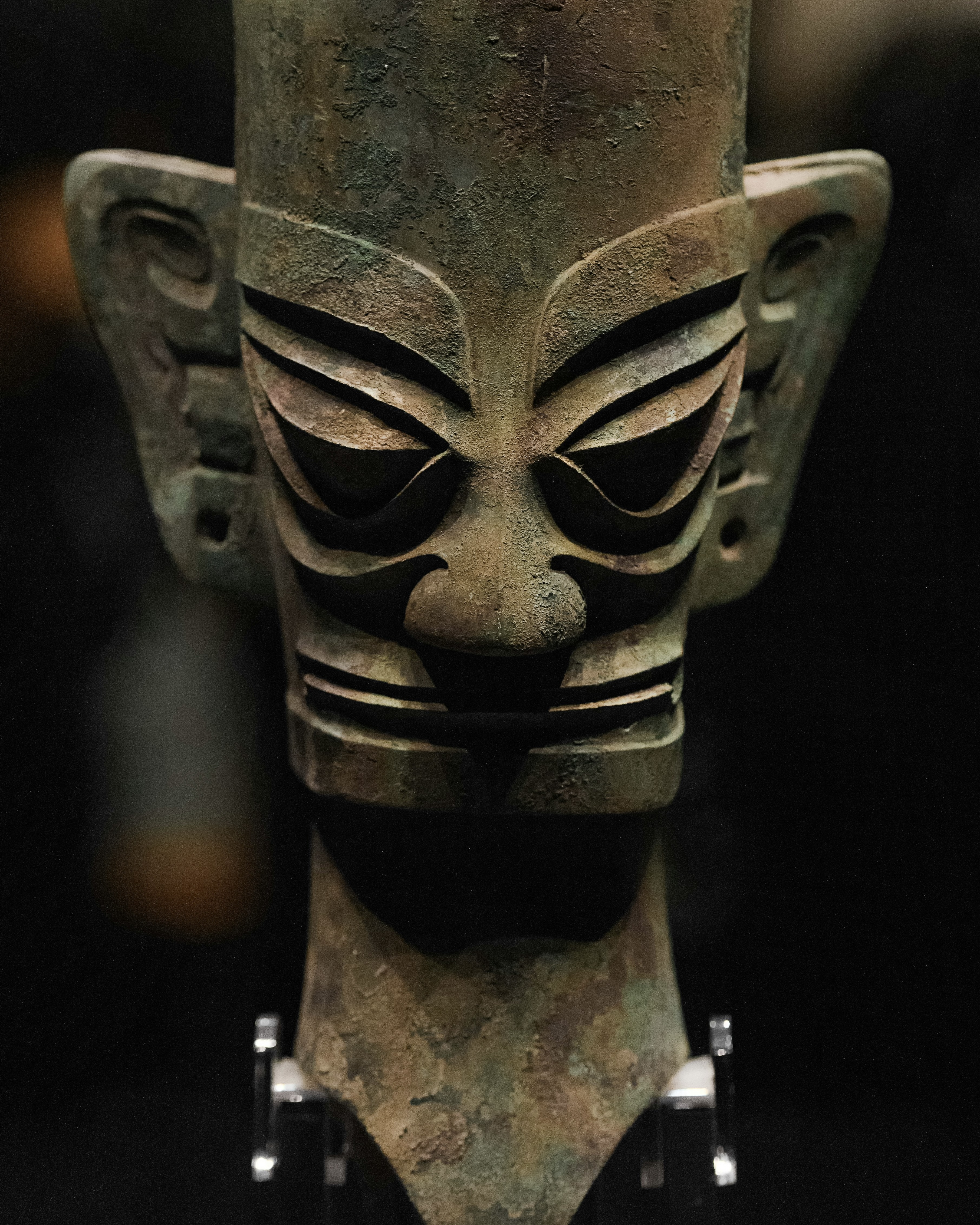 Iconic Sanxingdui bronze mask with geometric brows and protruding eyes