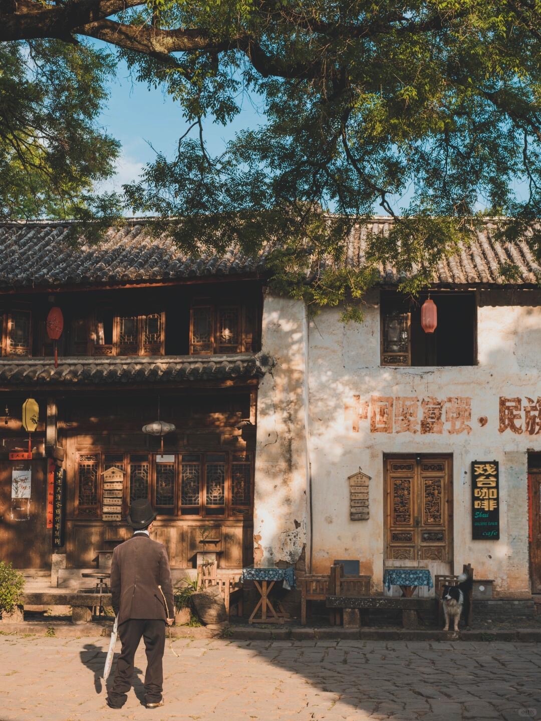 Stone-paved street and Bai courtyard wall in Shaxi