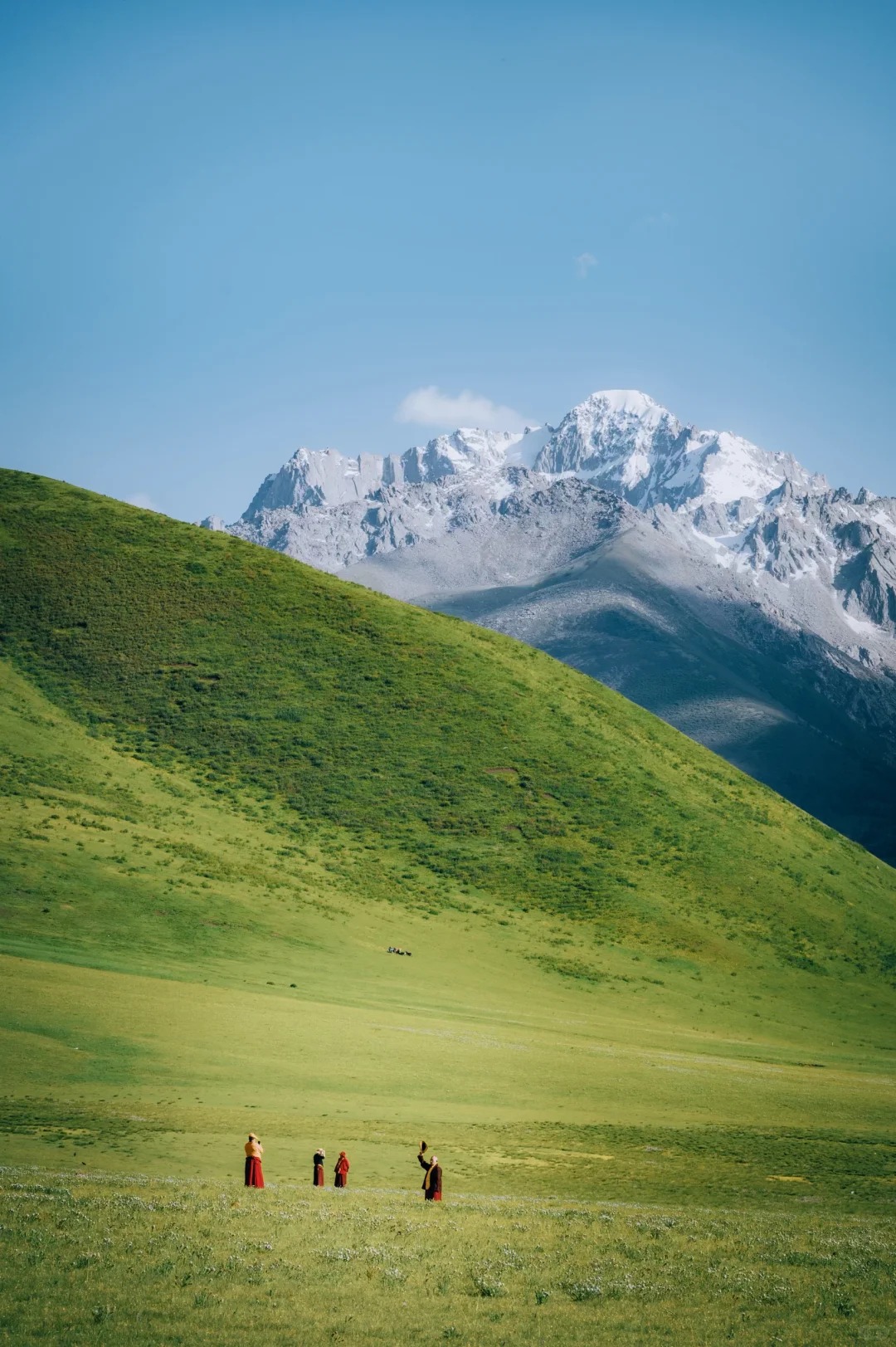 Zhuqing Temple nestled in a high valley with Genie's sacred peak rising behind, Litang