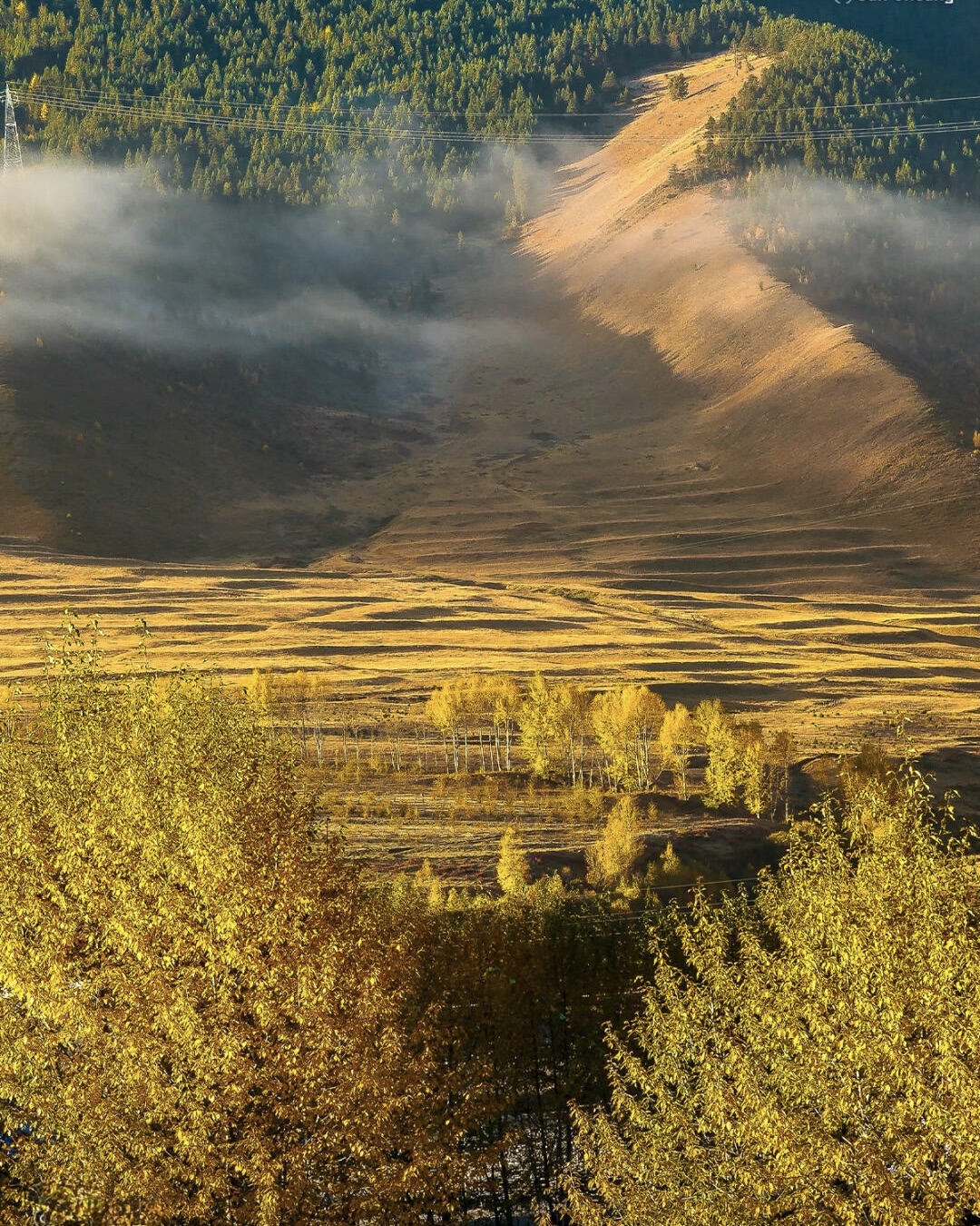 Warm sunrise light on Mt Gongga from Xinduqiao — the G318 corridor you came in on