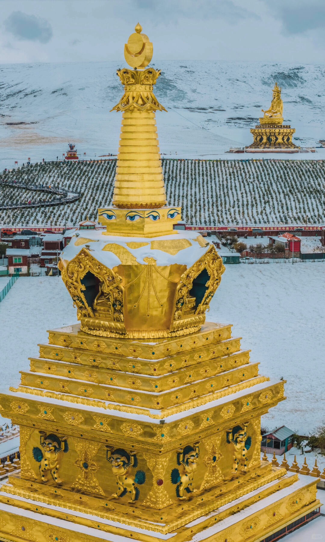 Wide landscape frame of Yaqing Gar nunnery in its Baiyu county valley, Ganzi, Sichuan