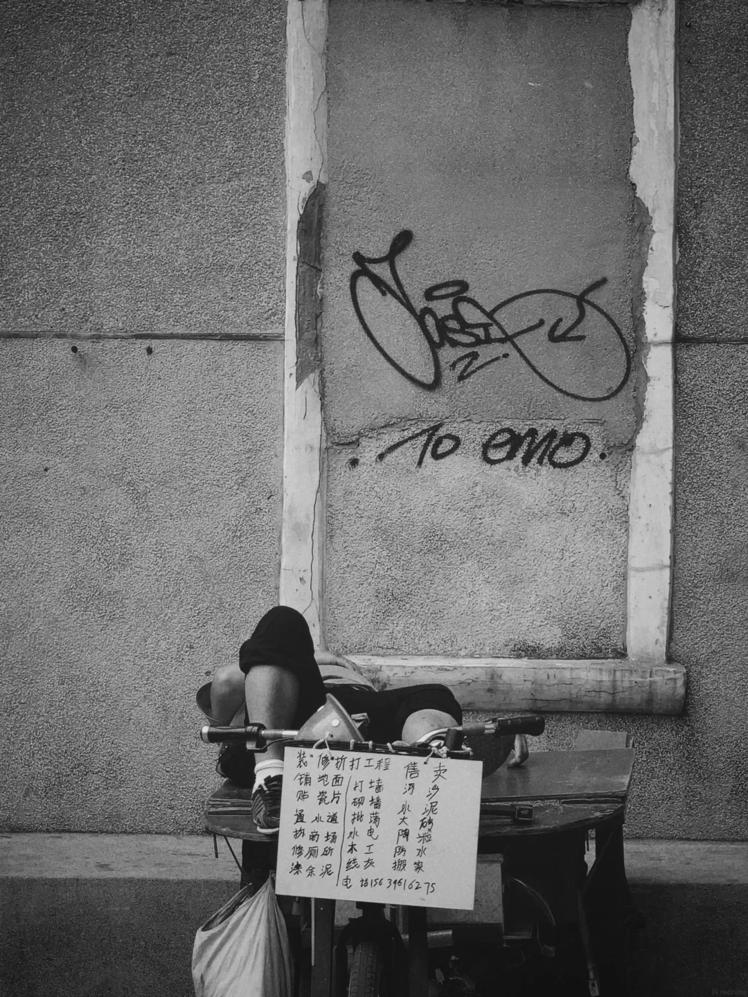Old-lane street life in Guangzhou's historic quarters — unhurried human texture in the city's back-streets