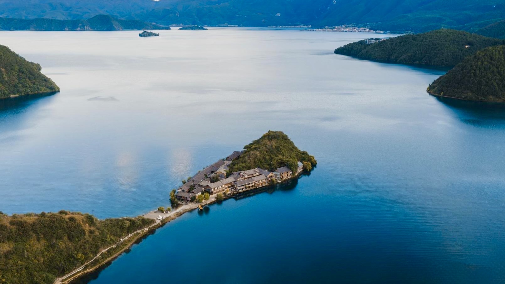 Lugu Lake's signature deep-blue water on a clear day