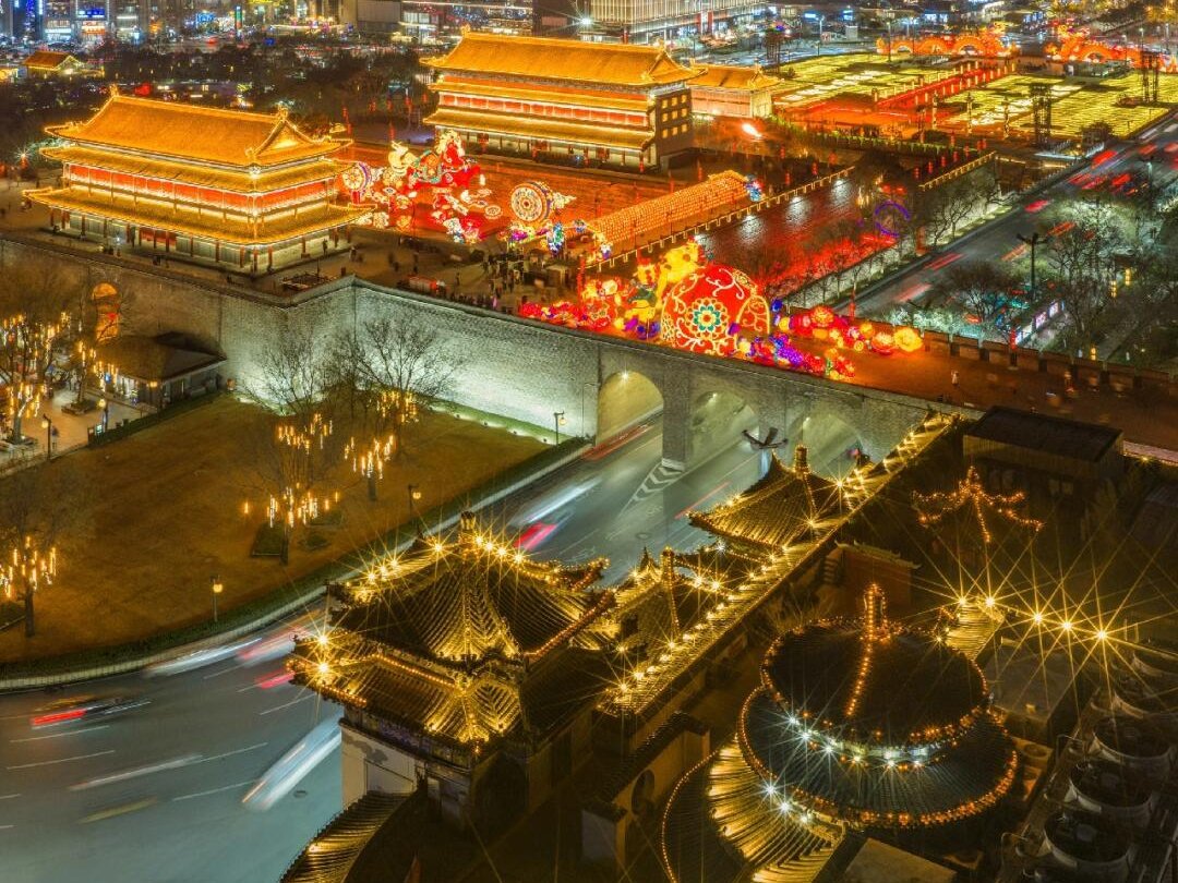 Xi'an's city wall and gate towers lit up with Spring Festival lanterns at night