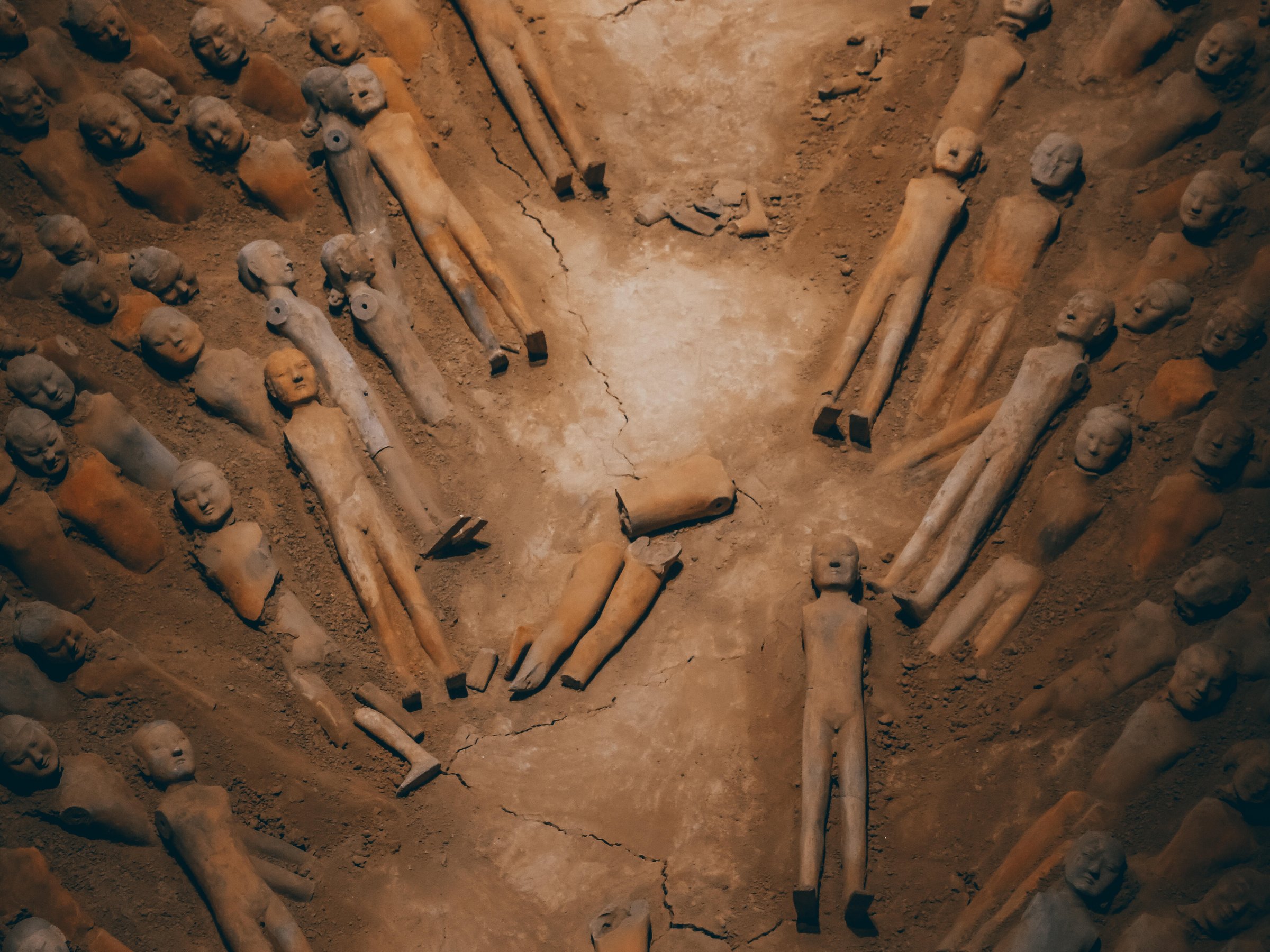 Rows of small clay figures lying in a burial pit at Han Yang Ling