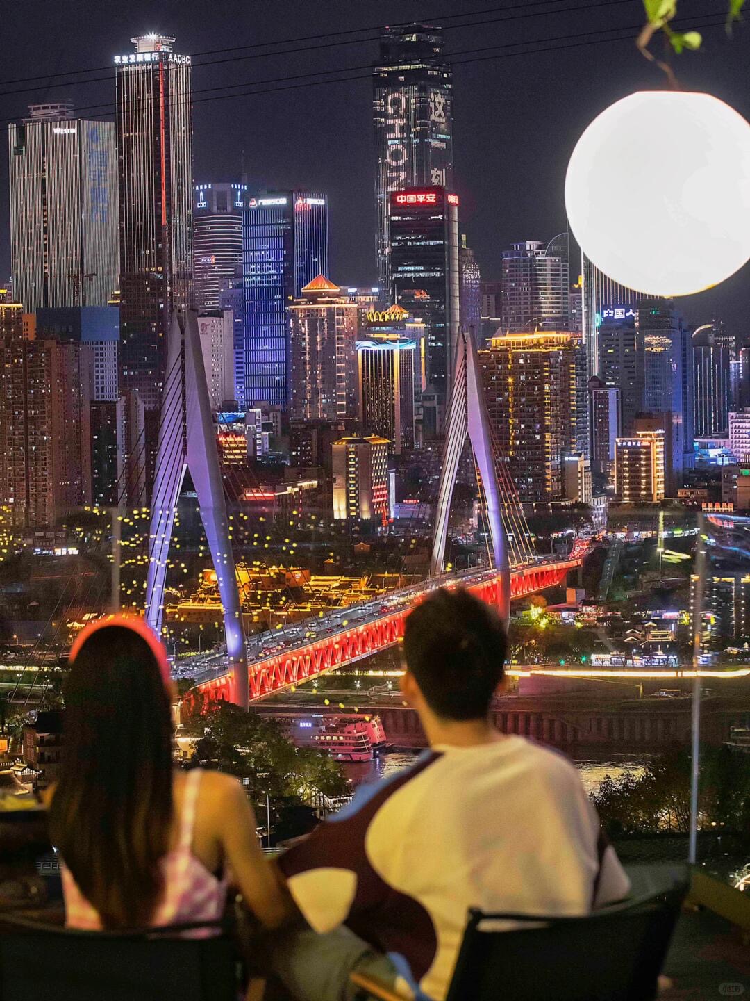 A Chongqing skyline photo spot — layered high-rises against river light