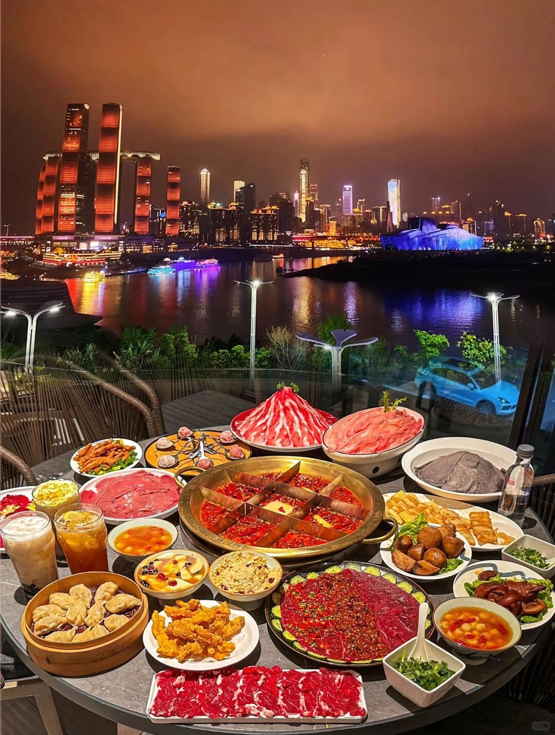 Dining at a stilt-house hotpot joint in Chongqing — traditional timber structure with a river view