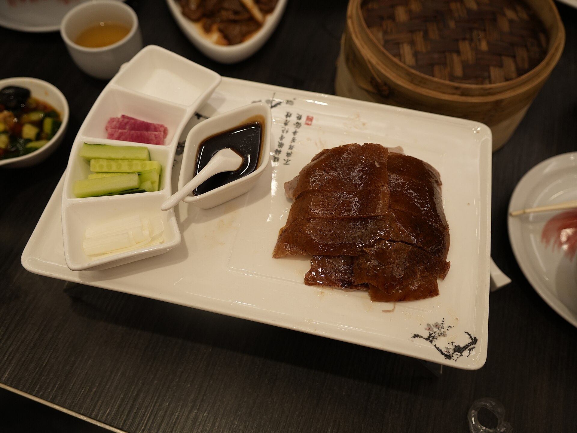 Lacquered Peking duck carved with pancakes and condiments, Beijing — Classic China tour