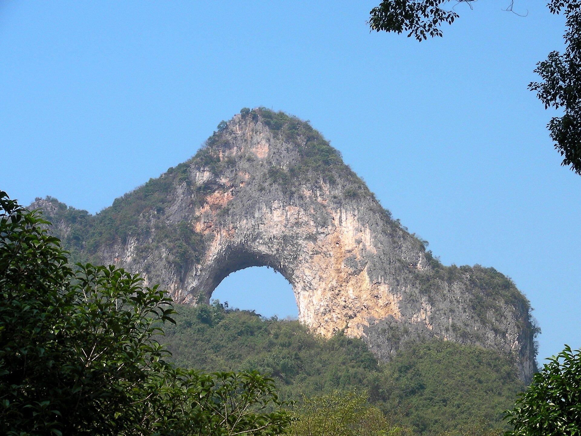 Moon Hill's natural limestone arch above the Yangshuo countryside — Classic China tour