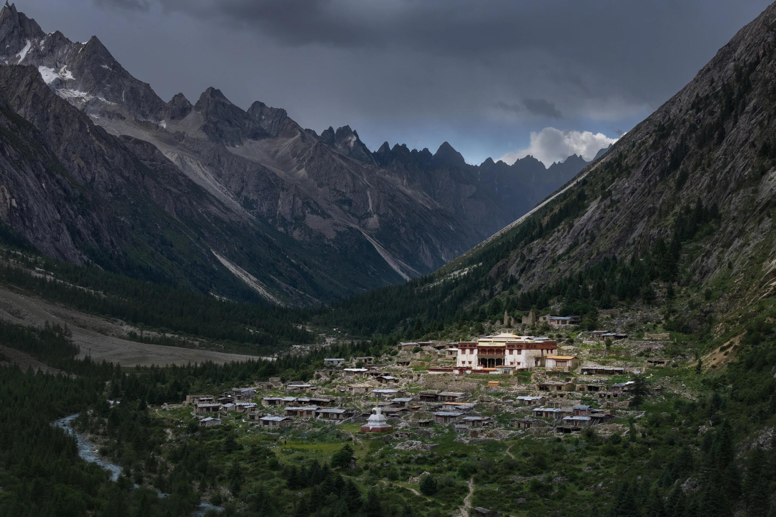 Leng-Gu Temple sits in a valley of jagged peaks below Mt Genie — atmospheric wide view from the hiking trail