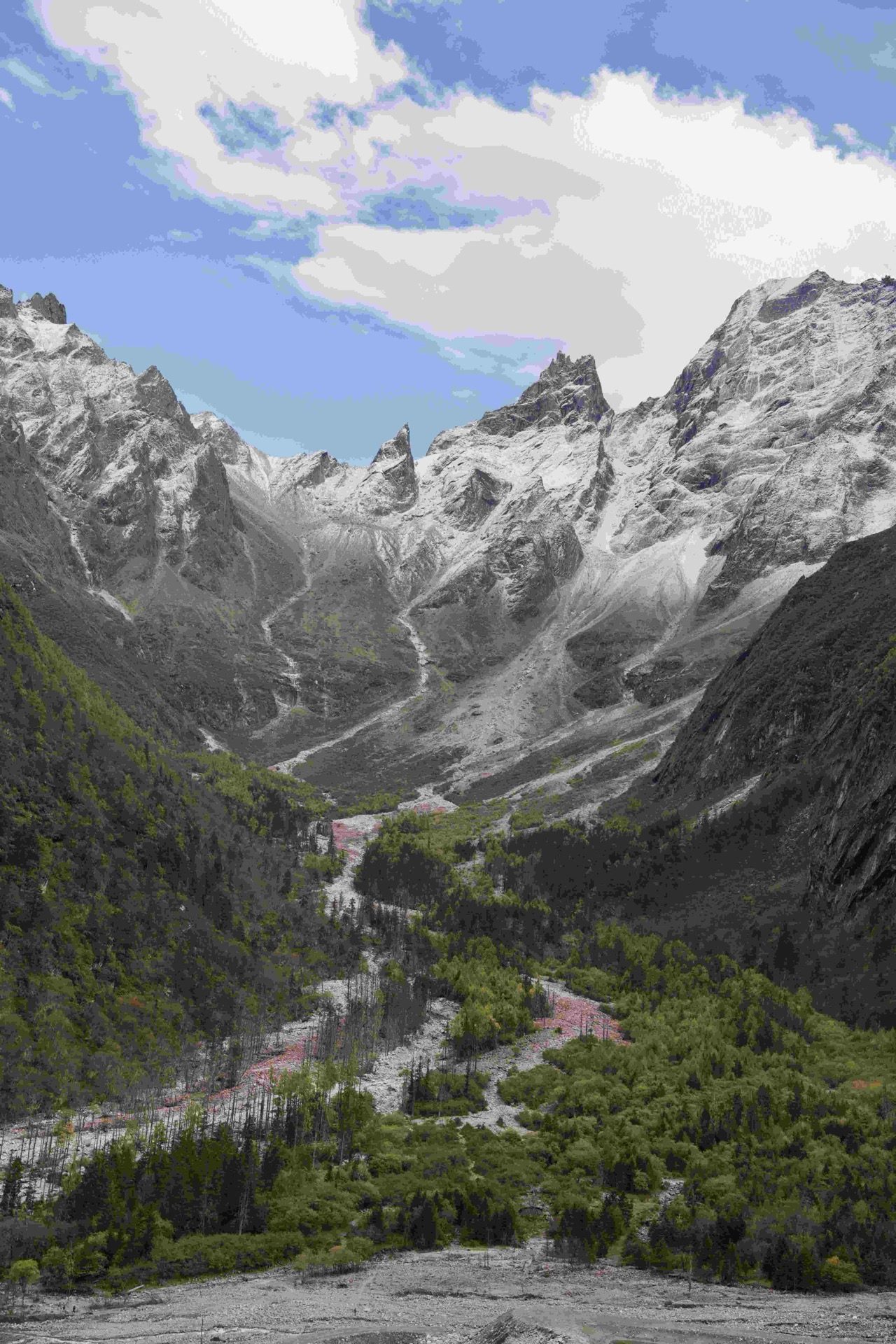 Dramatic switchback road cutting through the Min Mountain gorges on the drive from Chengdu toward Lixian