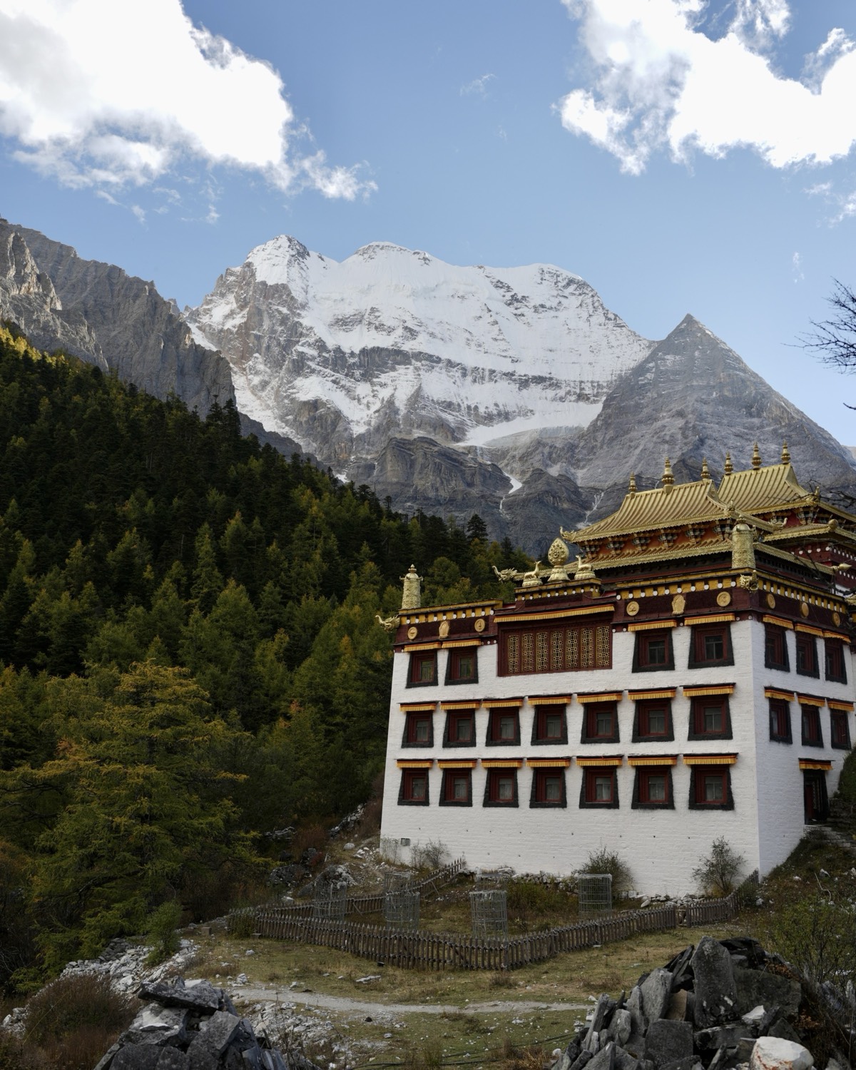 Chonggu Monastery sitting beneath a sacred snow peak in Daocheng Yading