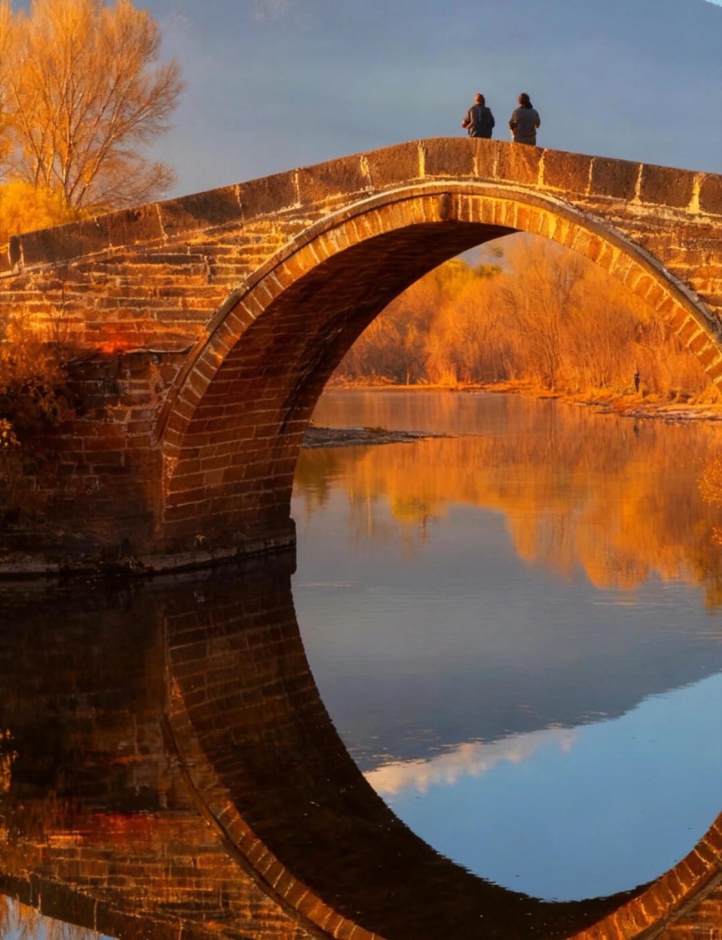 Golden temple reflected in Erhai Lake at dusk, Dali