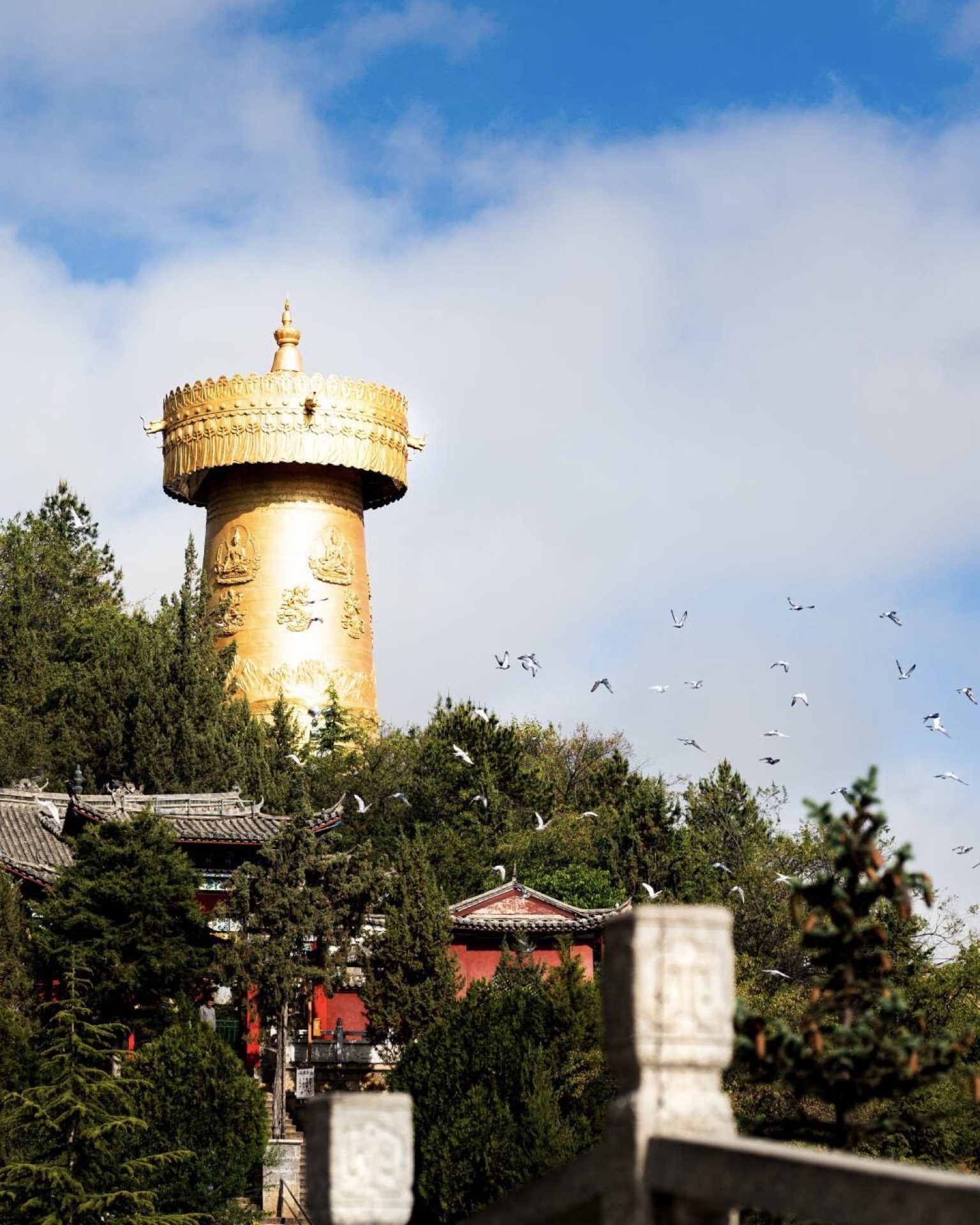 Cobblestone alley flanked by whitewashed walls in Dukezong Old Town, Shangri-La