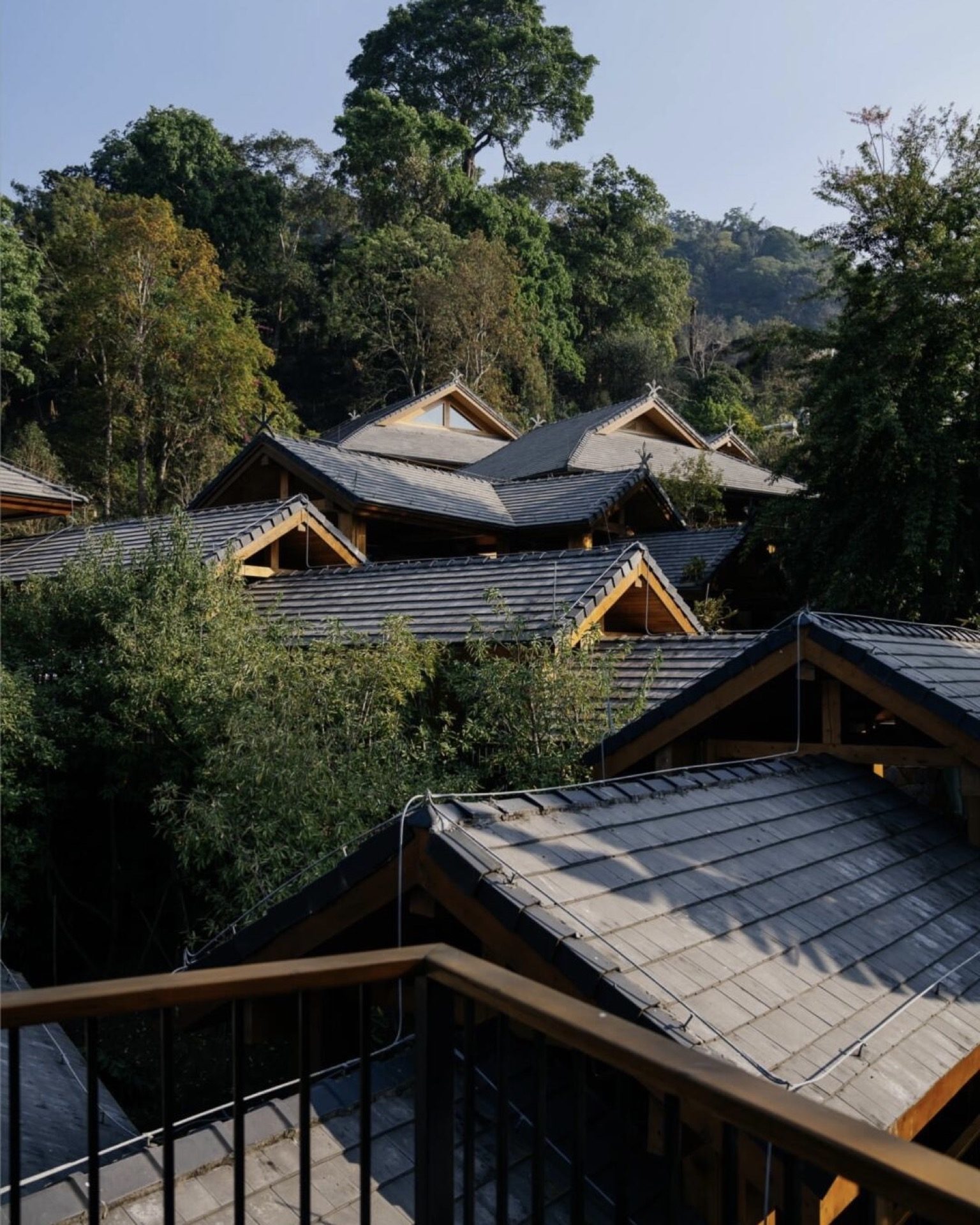 Architectural detail of a boutique resort on Jingmai Mountain — natural materials and traditional craft joinery — Yunnan tropical tour