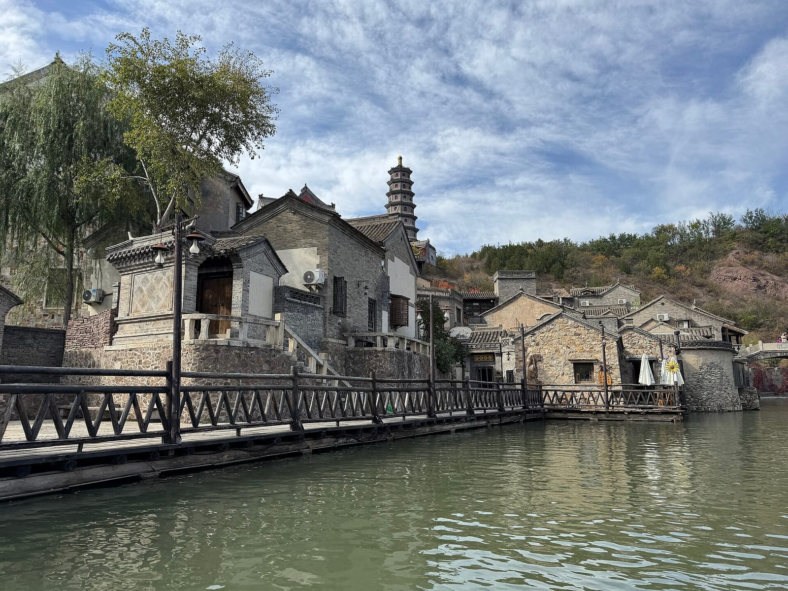 A canal, stone houses and a pagoda at Gubei Water Town below Simatai — Wild Great Wall hike