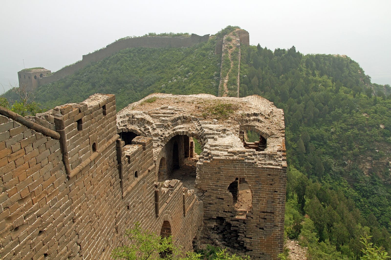 A roofless Ming watchtower on the Gubeikou wall, its brick open to the sky — Wild Great Wall hike