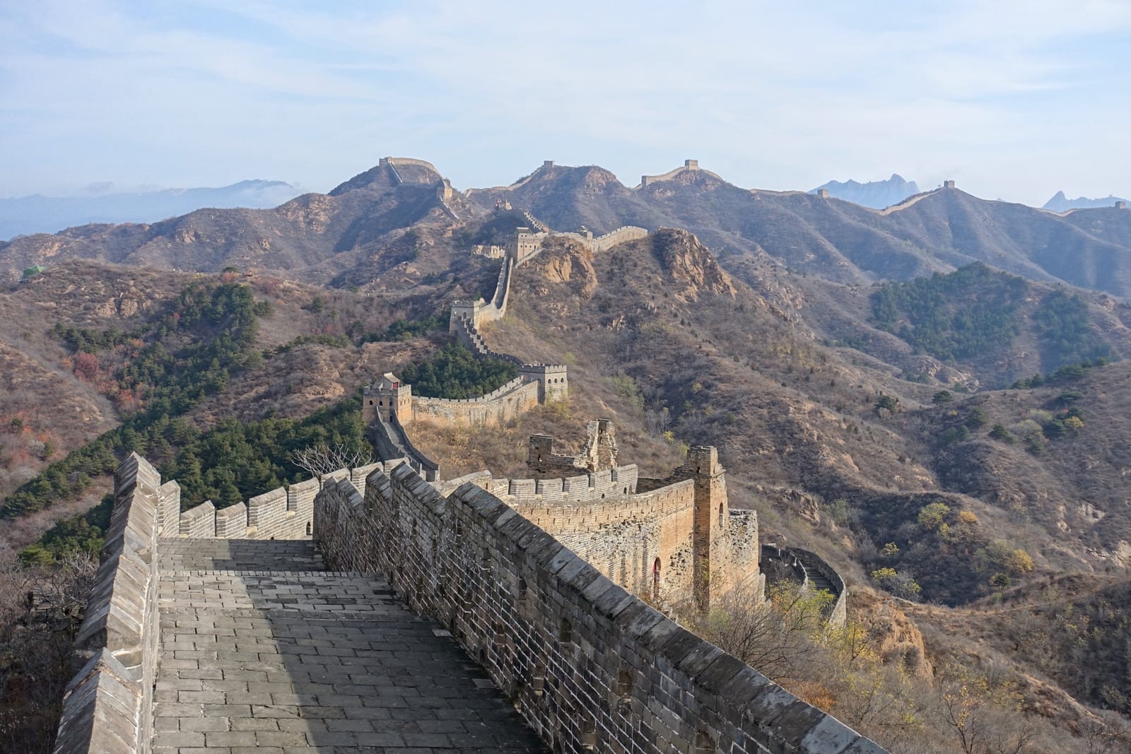 The Jinshanling Great Wall and its chain of watchtowers along an autumn ridge — Wild Great Wall hike
