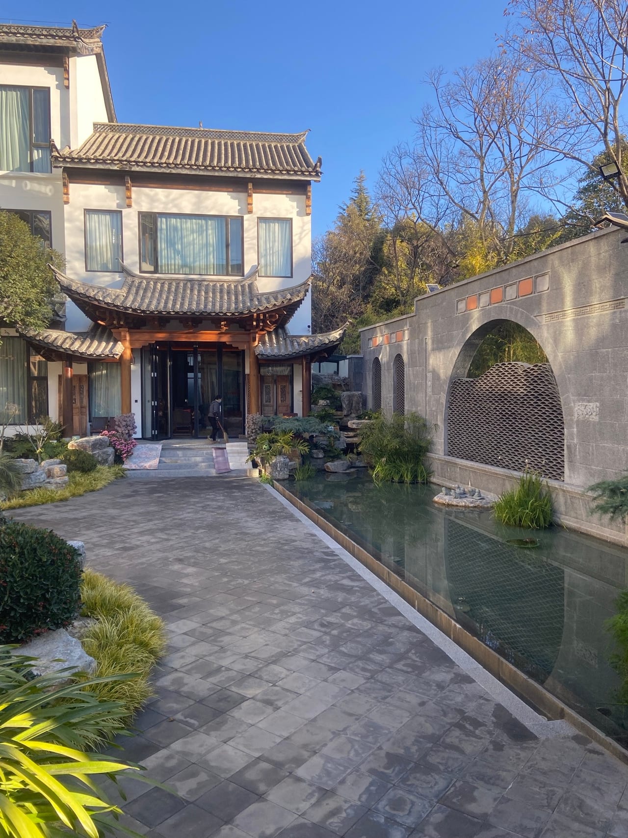 He Ting · Awamei — the entrance court, a water channel running beside the path