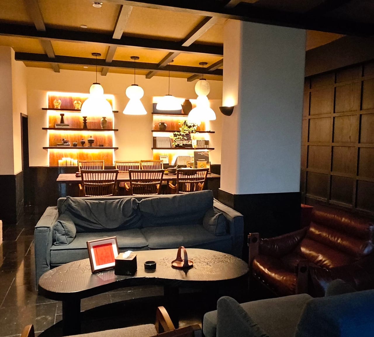 Kasion Erhai — the bar and lounge, lit shelving above low seating