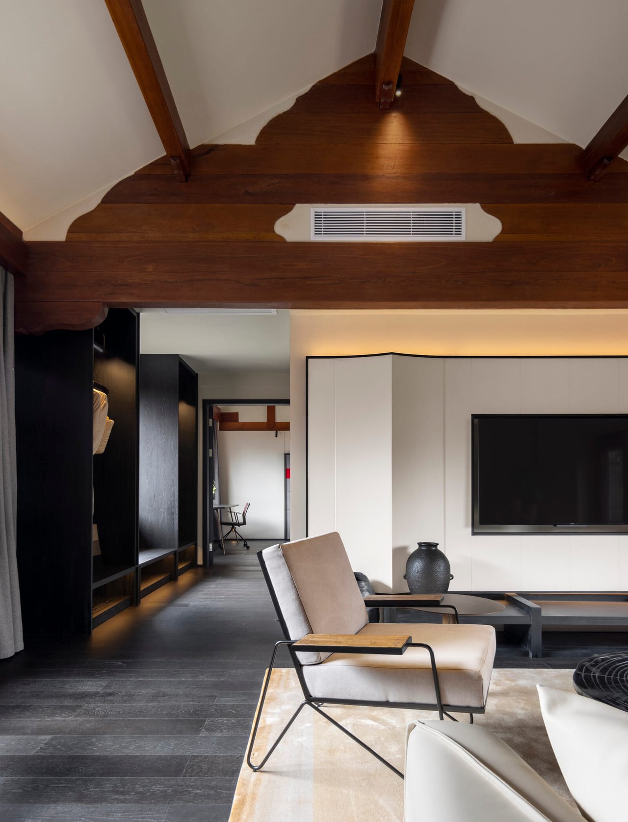 Kogongdi — a guest room under the original timber vault, contemporary fittings inside the old shell