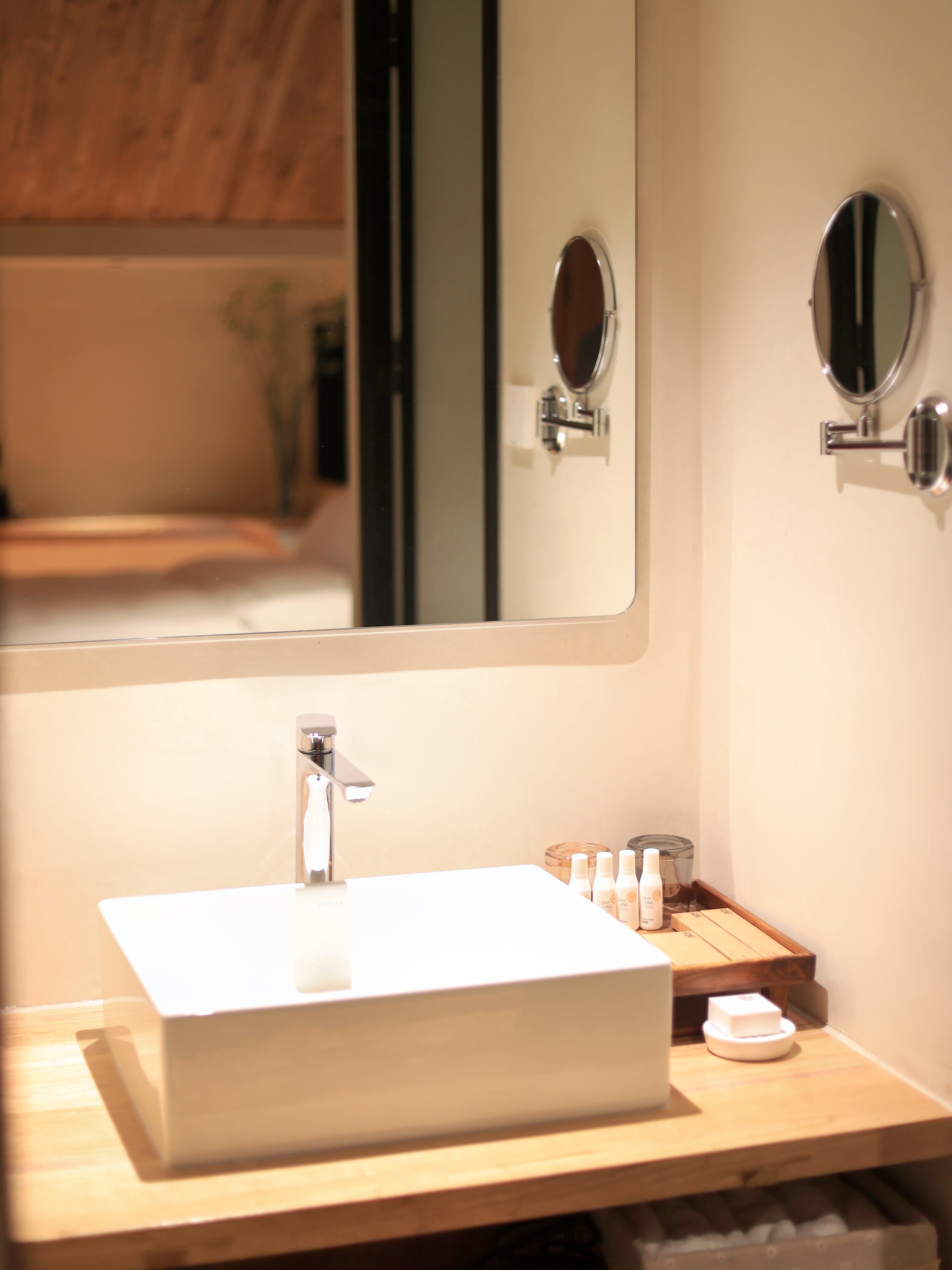 Porcelain Inn — modern bathroom with vessel sink and wooden counter, Dali Ancient Town