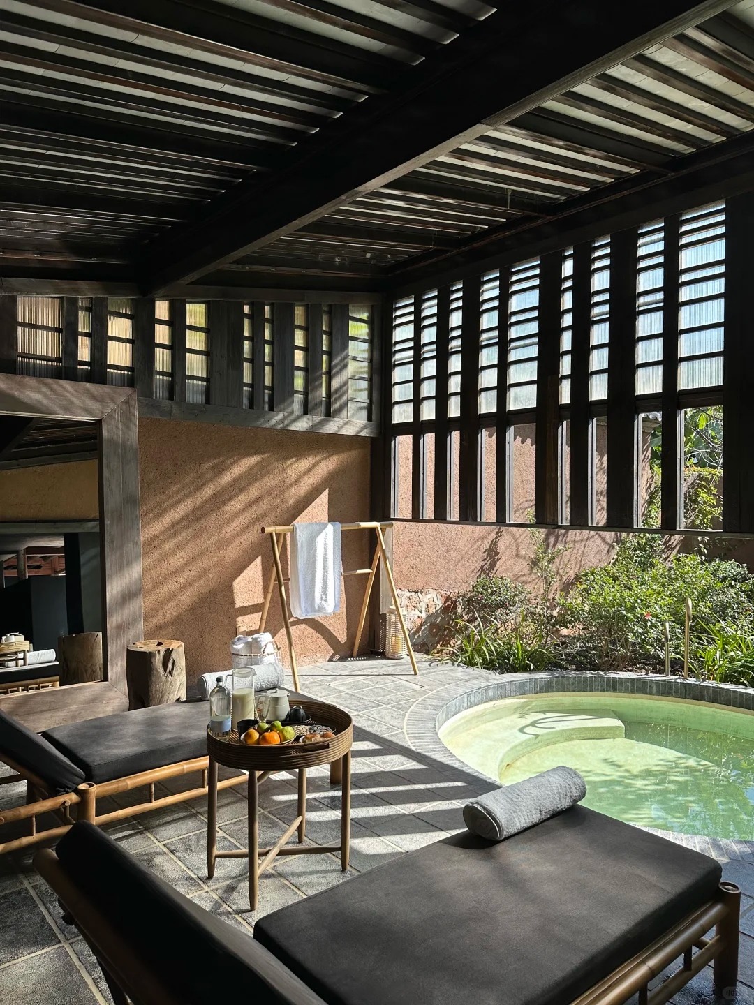 Pushan retreat exterior — timber pavilions in bamboo-and-pine forest, Eryuan, Dali