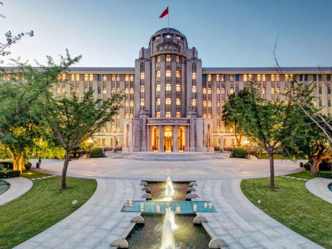 Sofitel Legend People's Grand Xi'an (西安人民大厦索菲特传奇酒店) — the 1953 People's Grand Hotel at dusk, a fountain running down the forecourt
