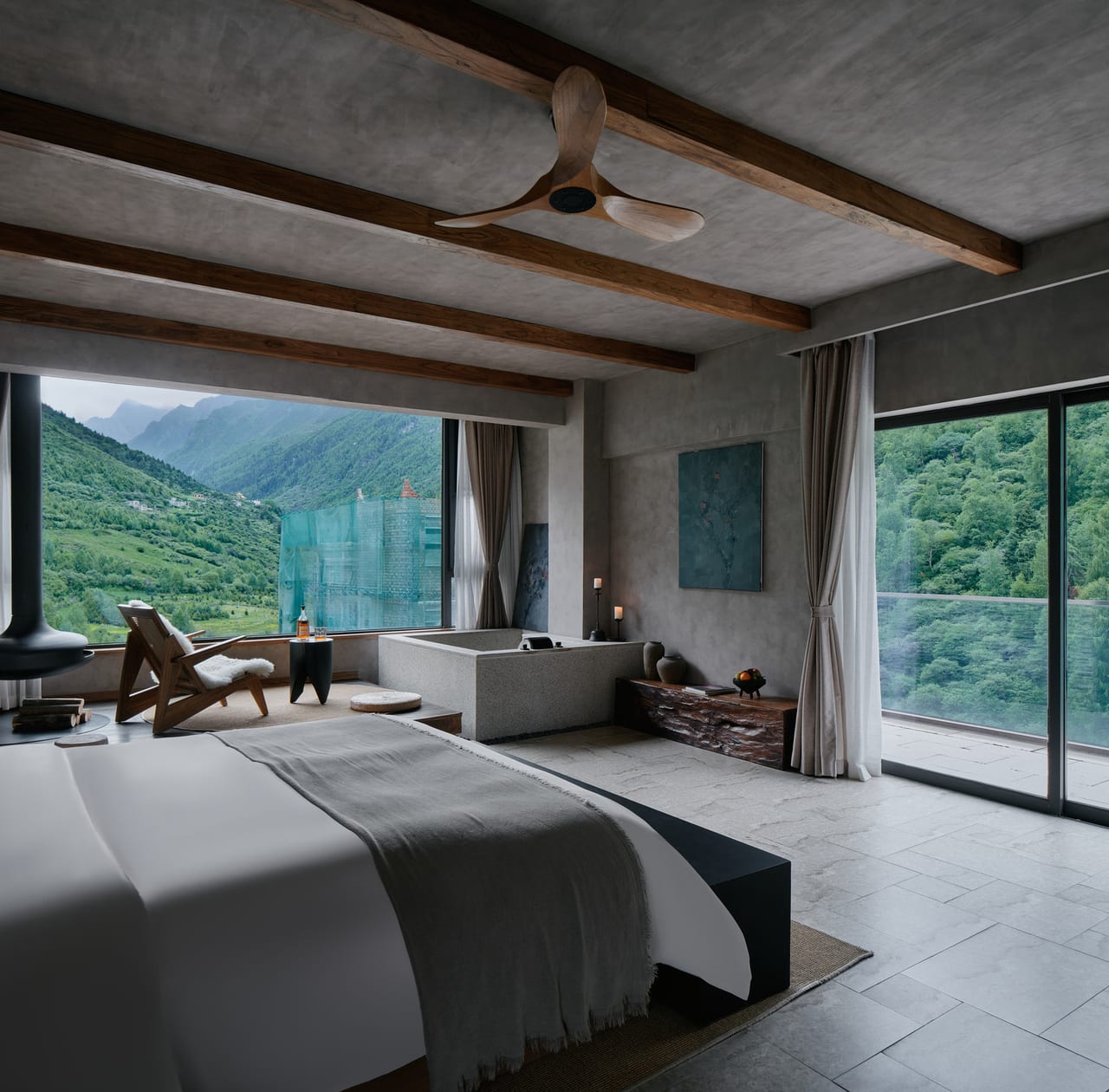 Vacilando Siguniang — bedroom with a stone tub facing the green summer slopes of the Changping valley