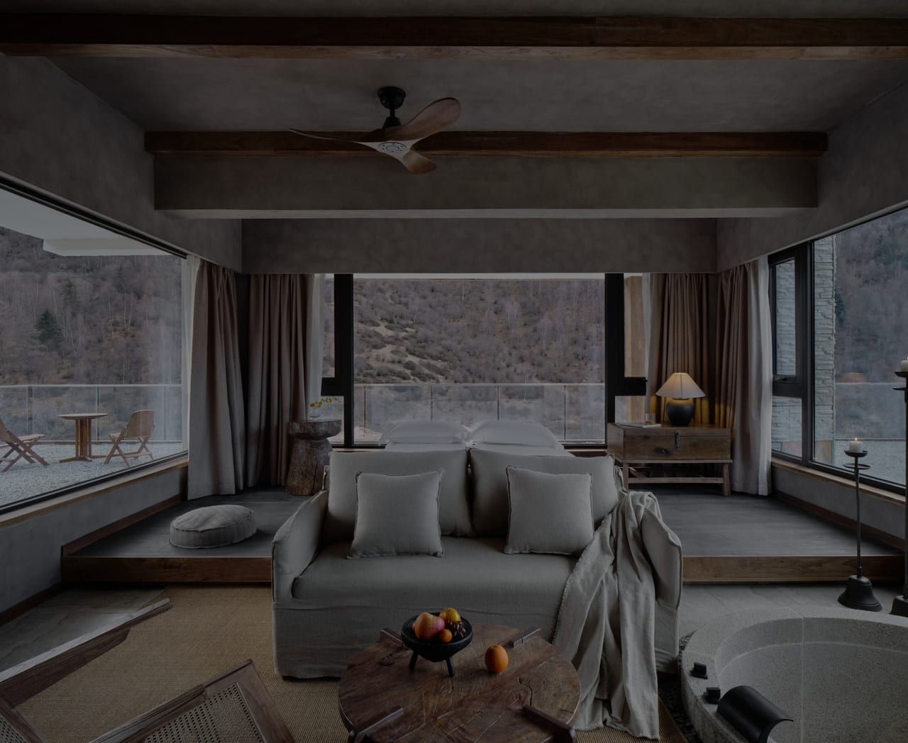 Vacilando Siguniang — suite living room wrapped in glass onto the Changping valley and the snow line