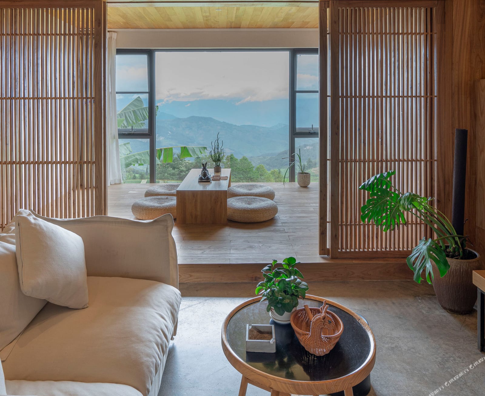 Yuanshe Azheke — guest room with full-height glass onto the terraces