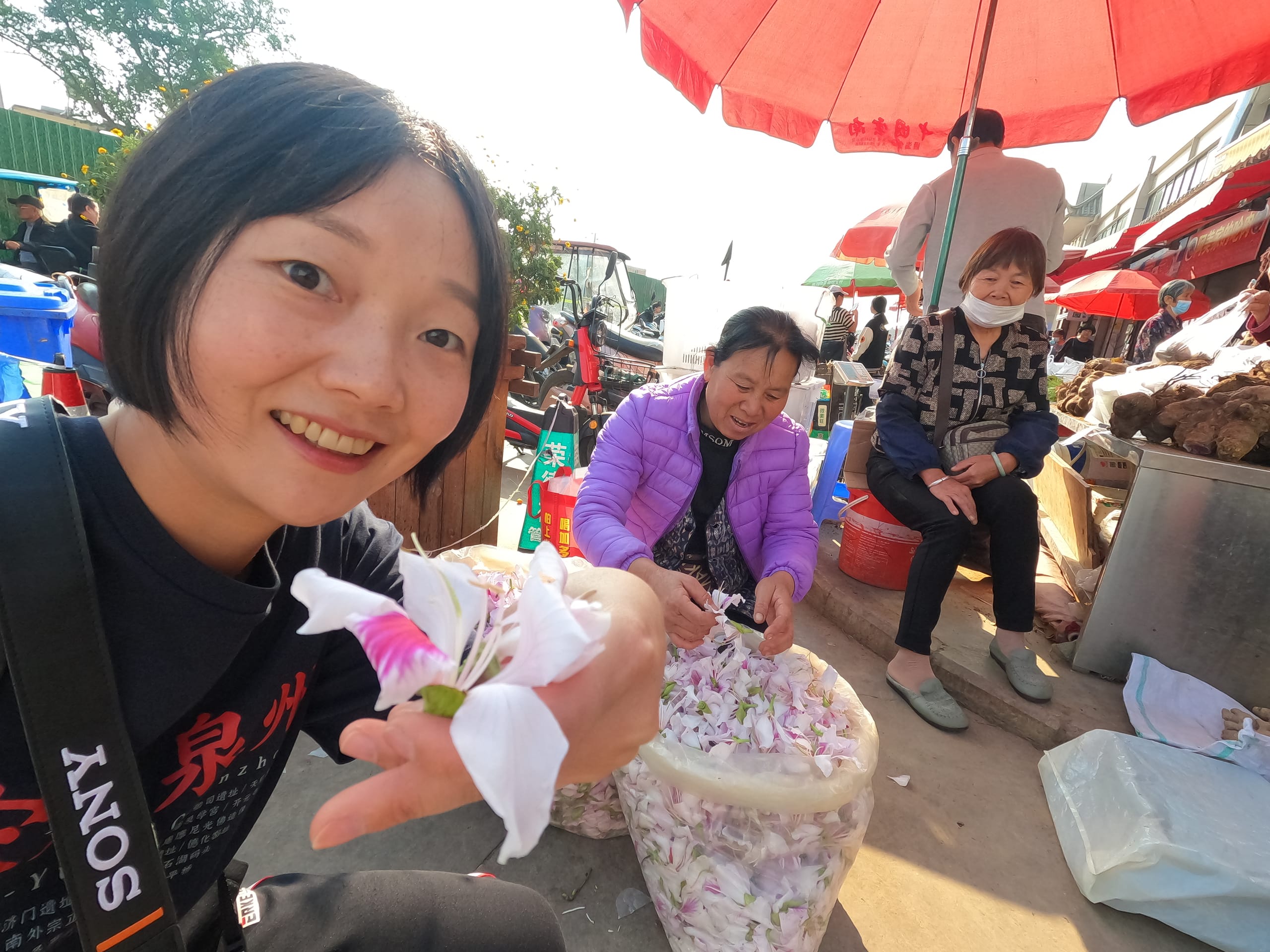 Sharing a moment with local vendors at a flower market