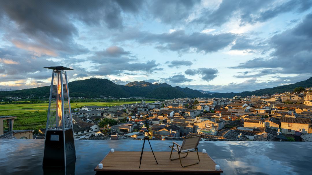 Rooftop terrace over Heshun old town at dusk